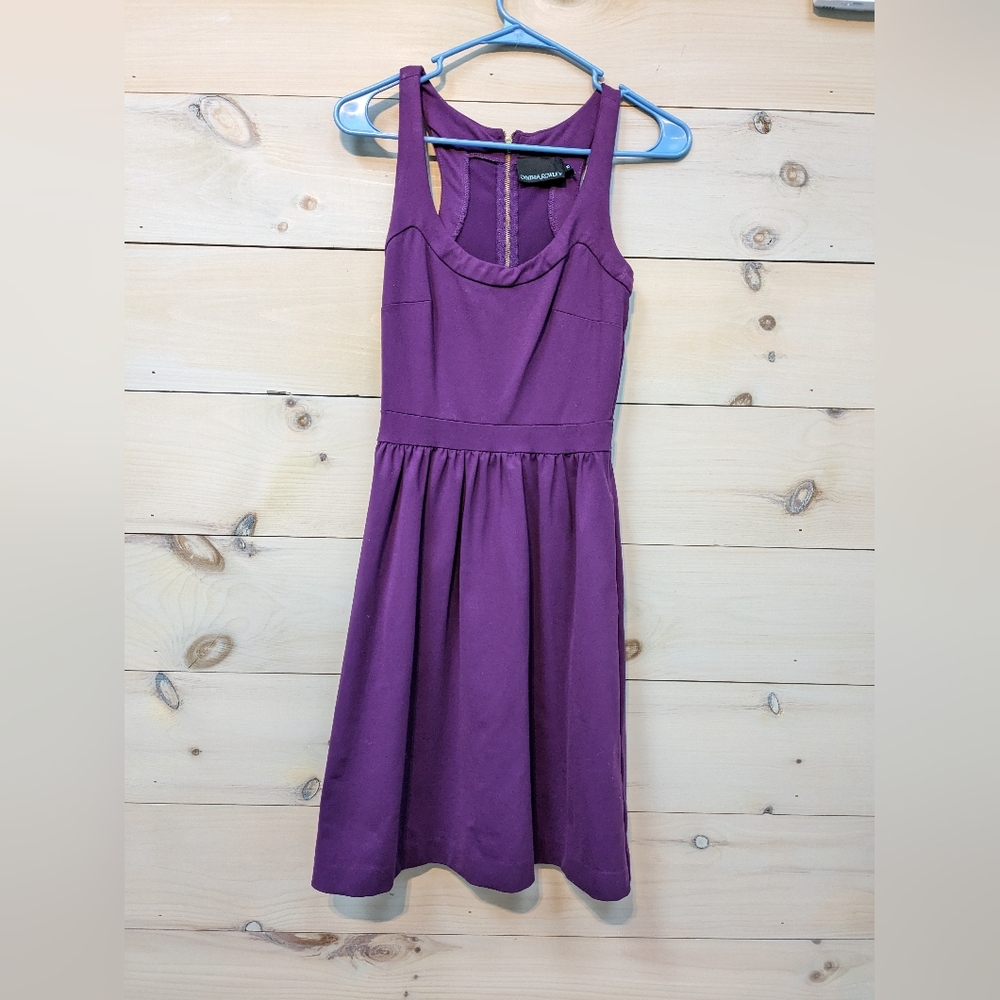 Purple fitted dress.